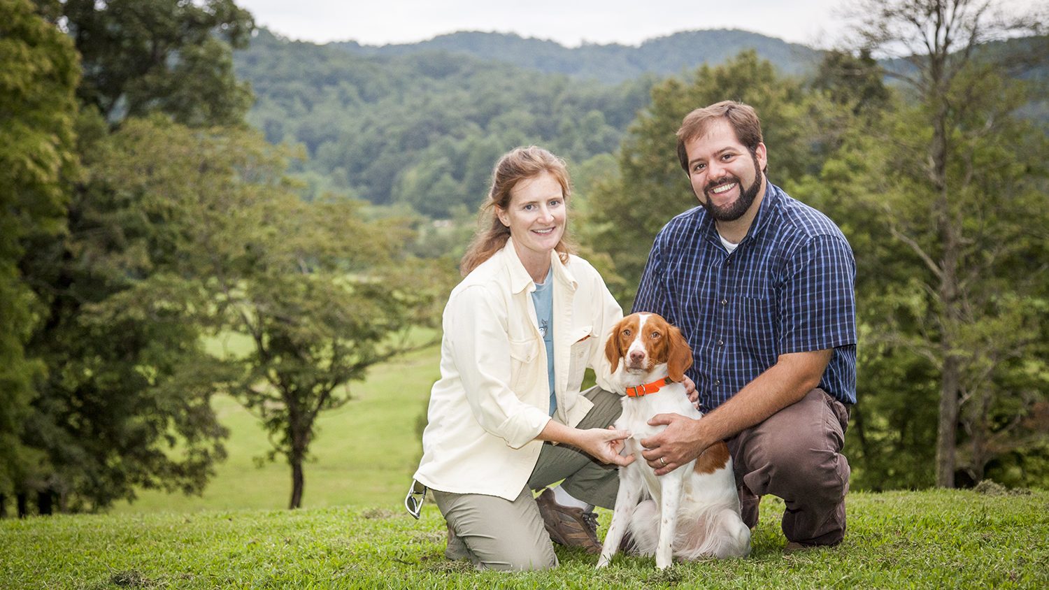 Brittany Whitmire and Andy von Canon with their dog on their farm.