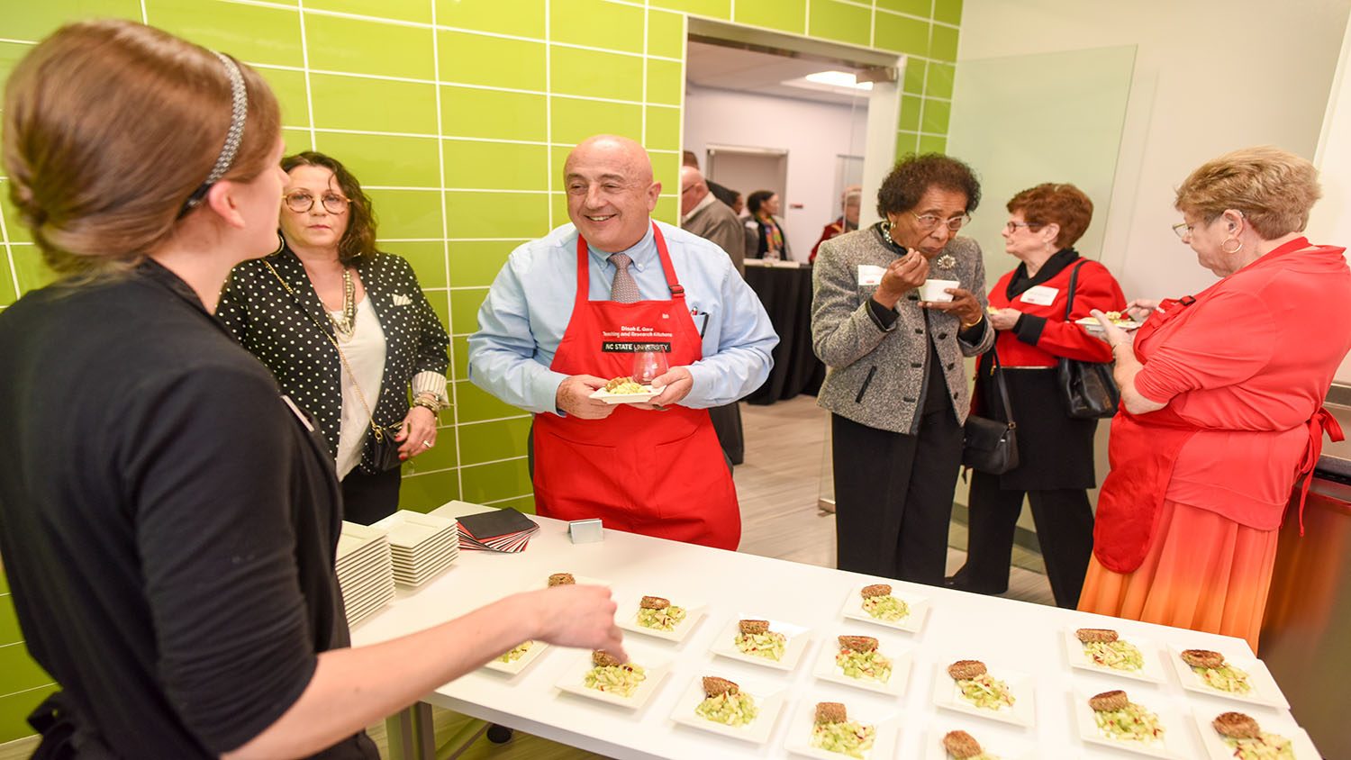 Dr. Bonnano taste testing at the Dinah Gore Kitchens Launch Event