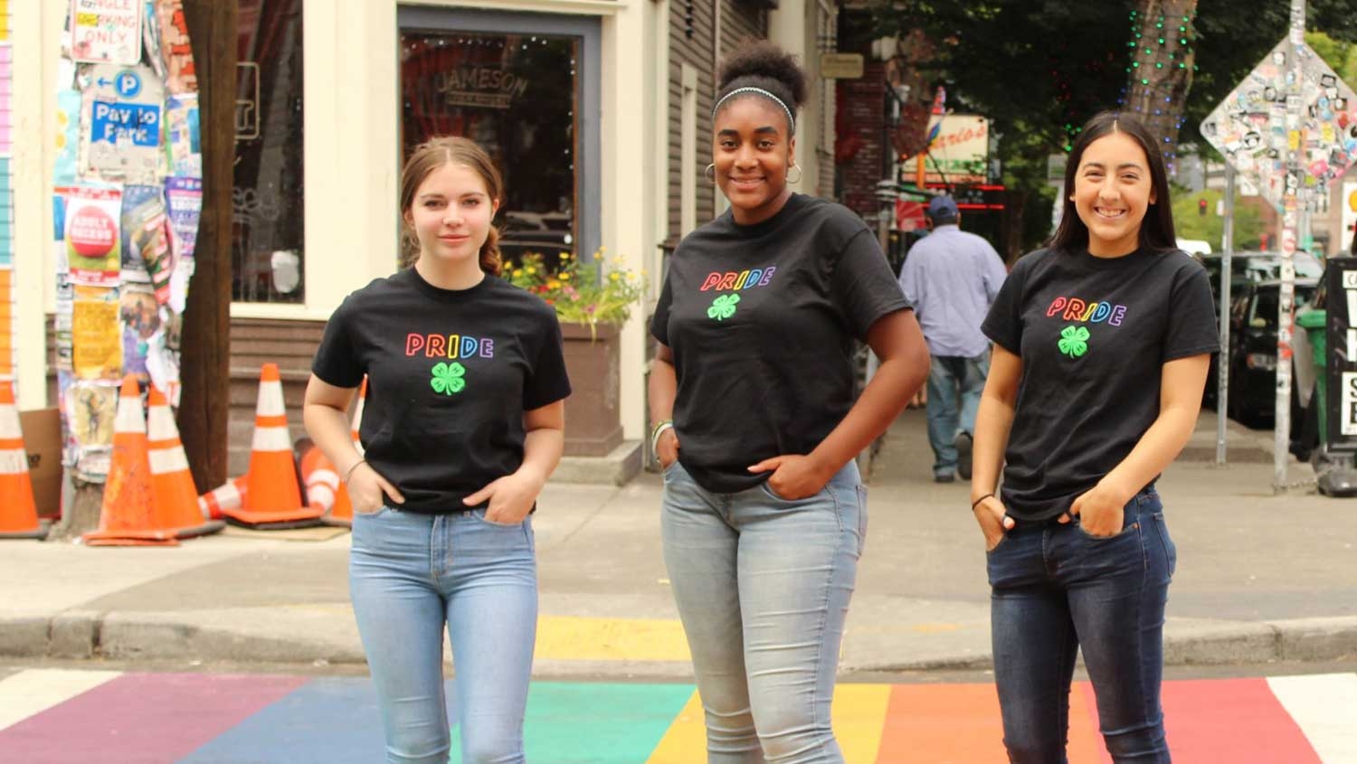 Three young women wearing 4-H pride T-shirts