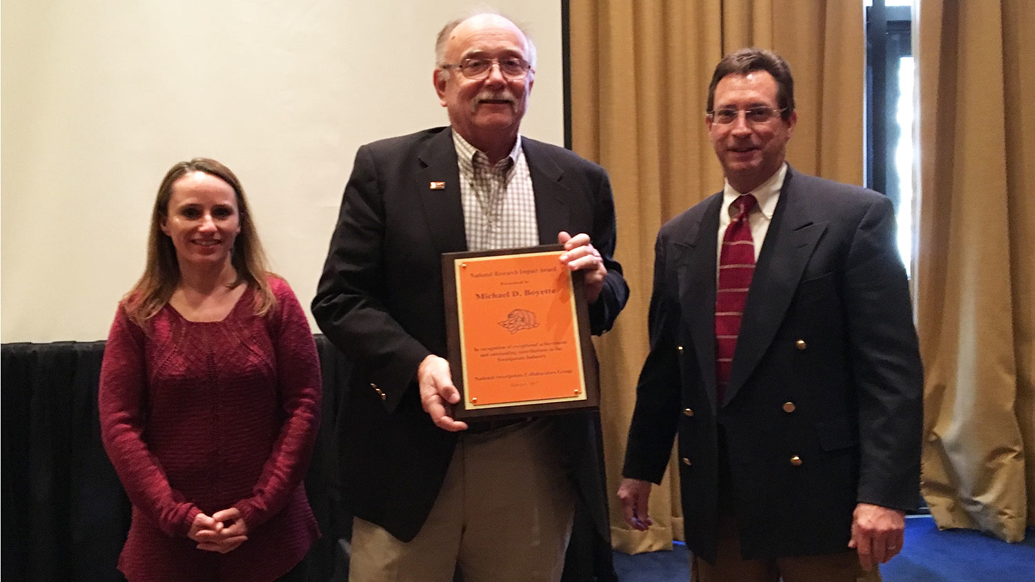 Mike Boyette receives the National Research Impact Award