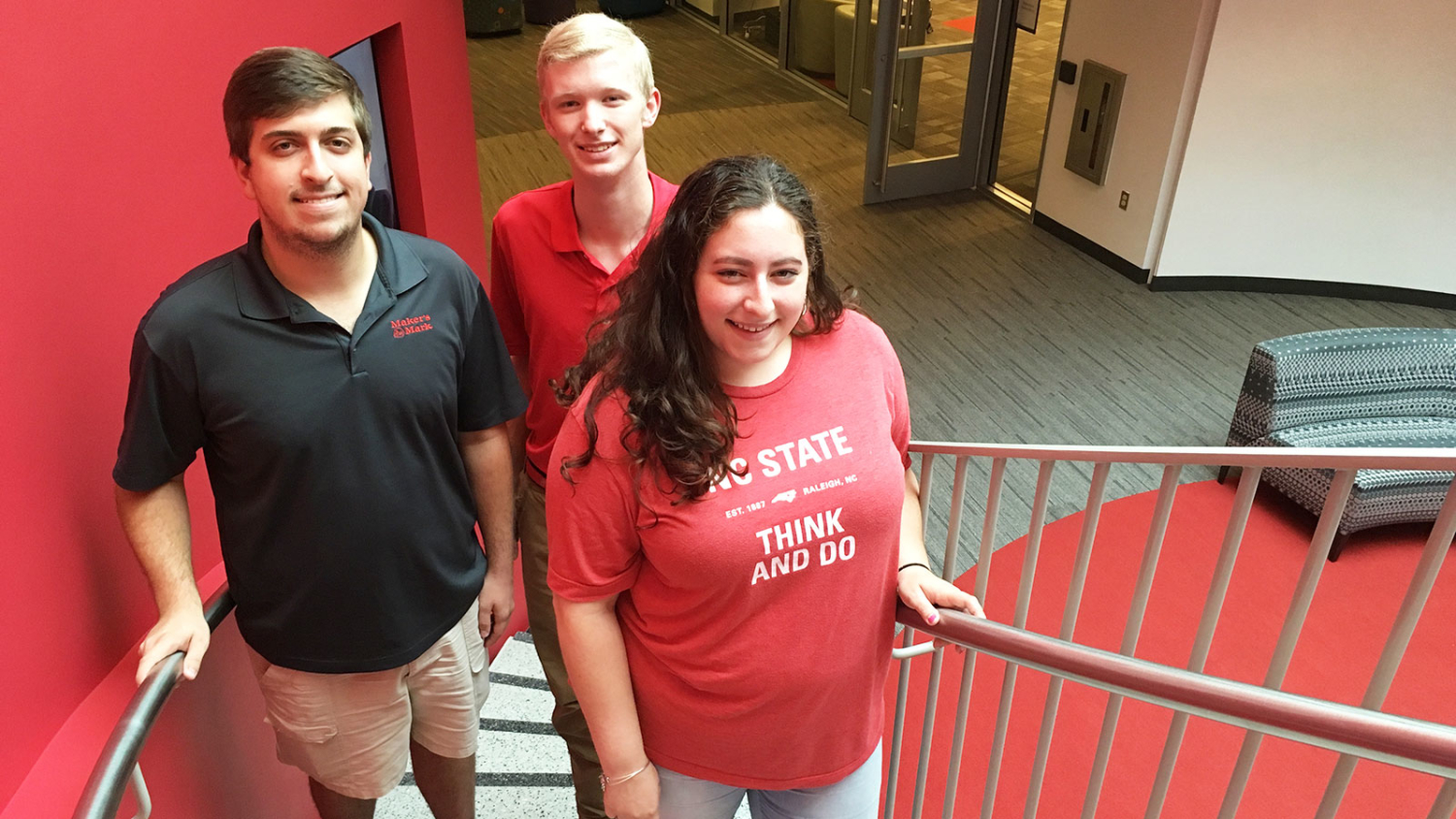 CALS students Harrison Walker, Luke Stancil and Victoria Pender standing on steps