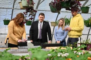 Aaron Fleming and 2 Students Outdoors