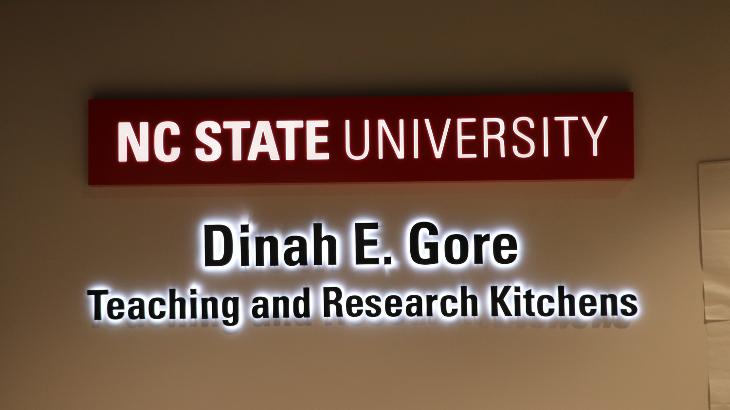 Shows text: Dinah E. Gore. Teaching and Research Kitchens