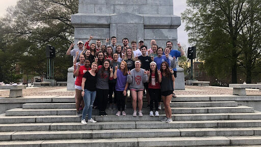 Group of students by NC State's belltower