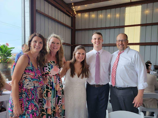 Picture of bride and groom and guests at their wedding