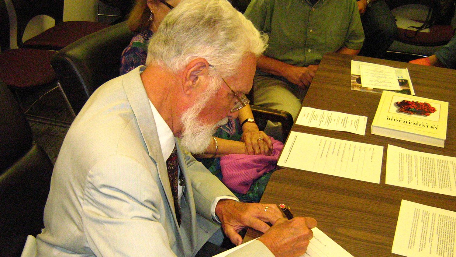 Dr. H. Robert Horton signs the agreement creating the new endowment.