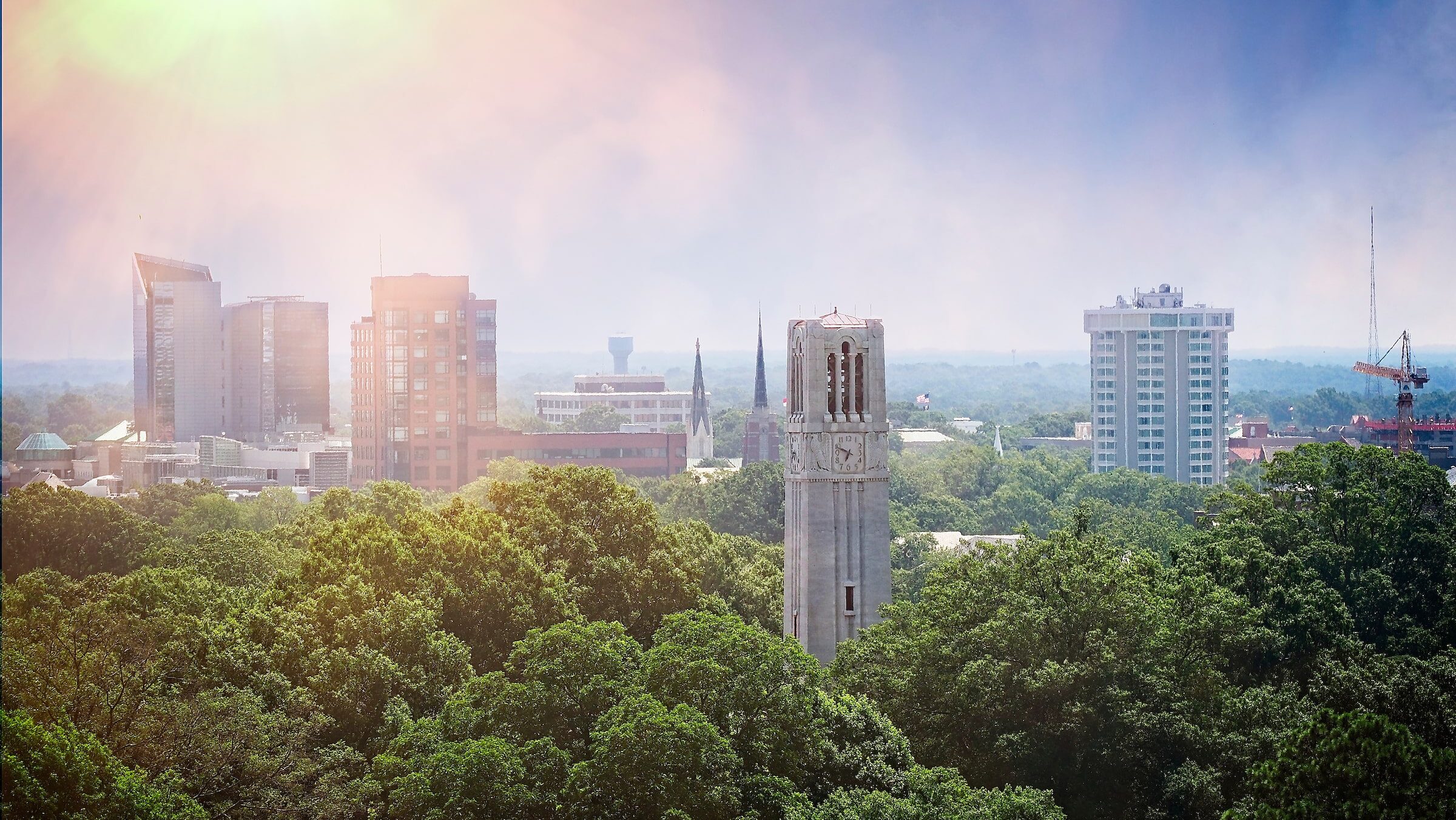 Aerial view of Belltower and downtown Raleigh to the east of campus.