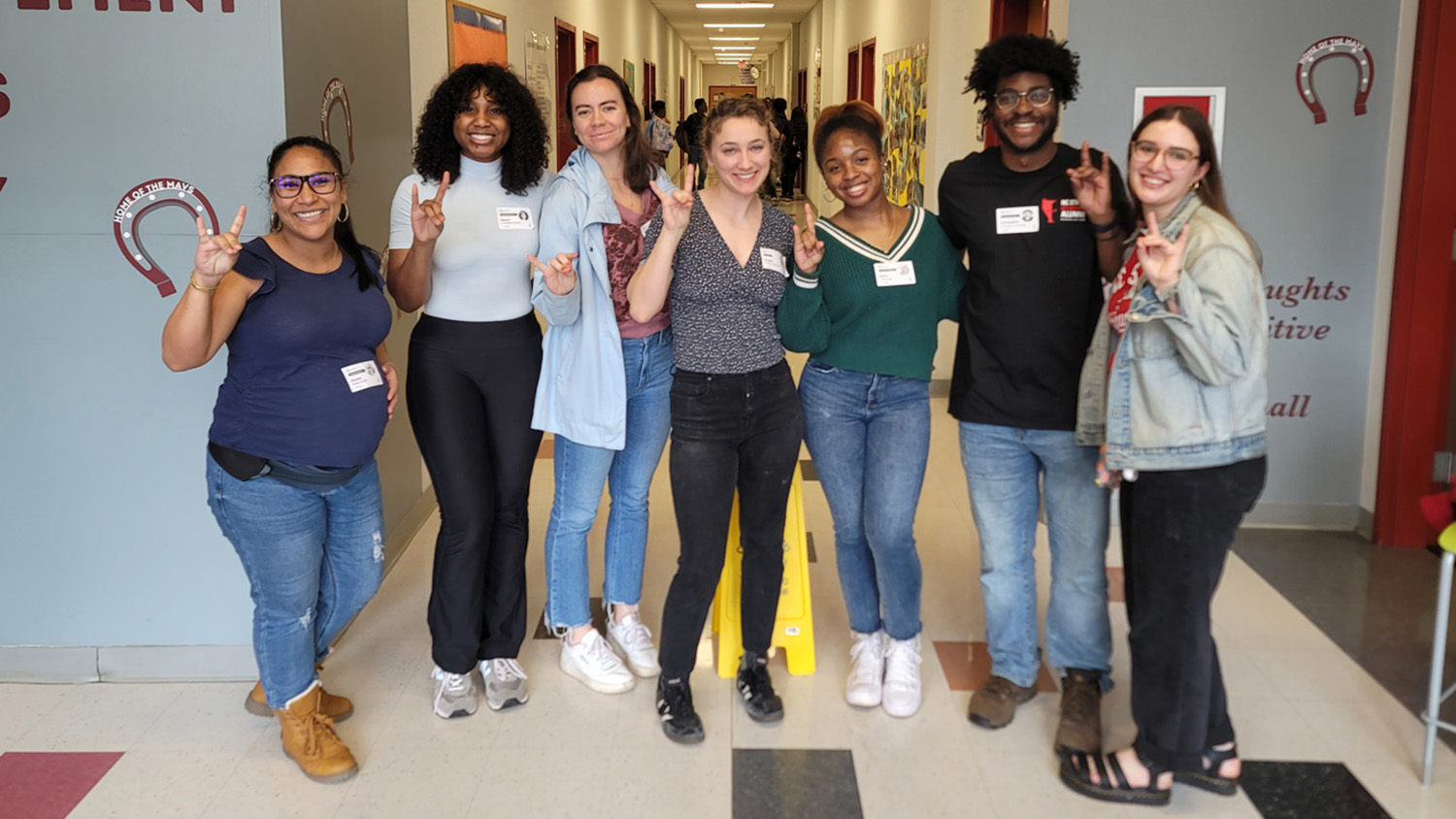 group of students posing in a lobby