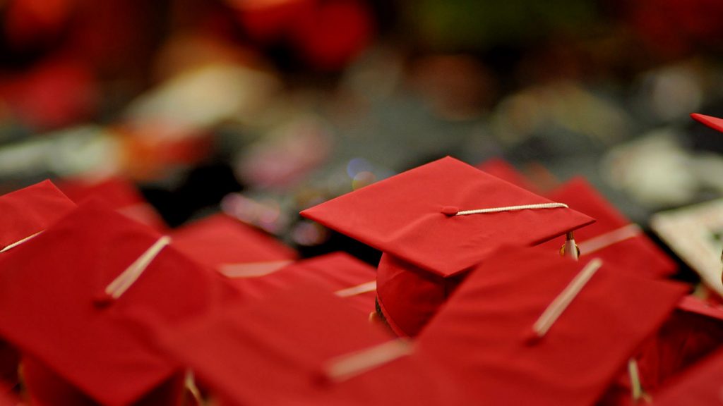 Photo of students in caps and gowns at NC State commencement