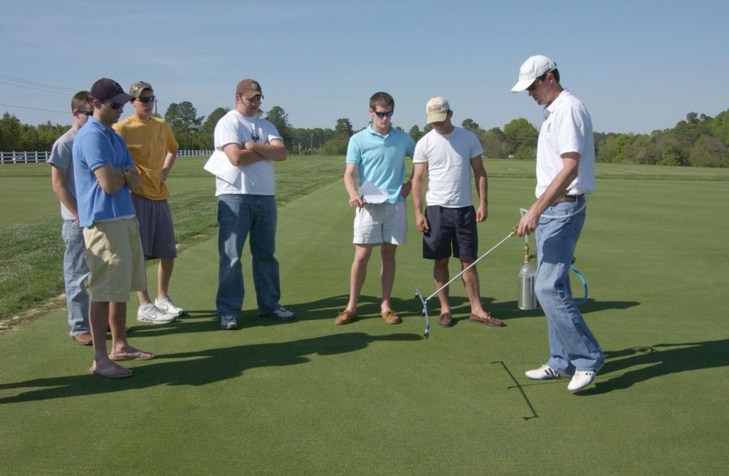 students discussing turfgrass management