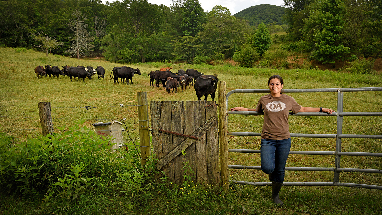 Student on a cow pasture.