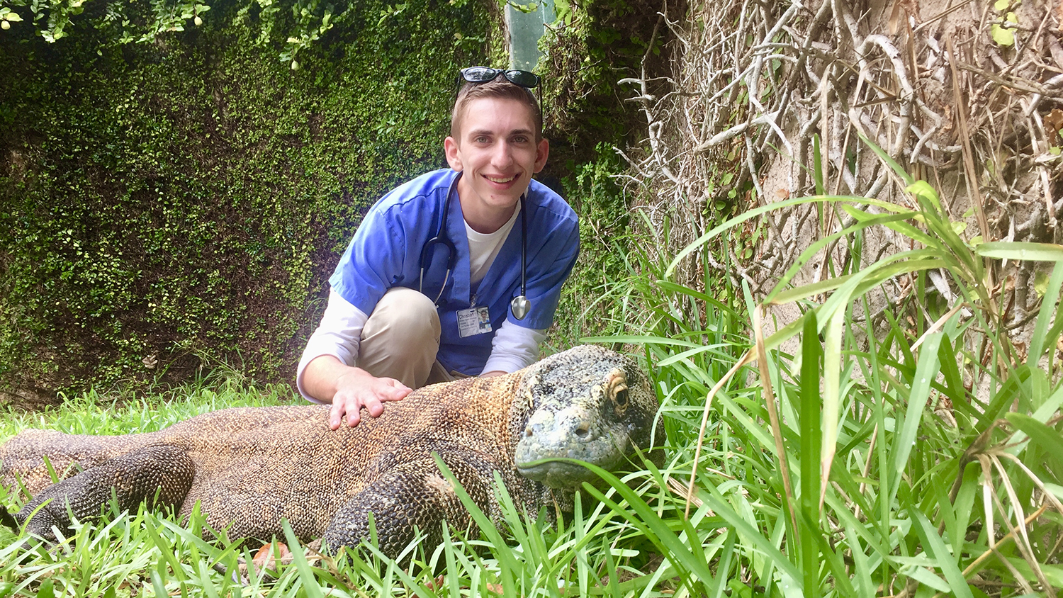 Animal Science student Christian Capobianco with a Komodo dragon.