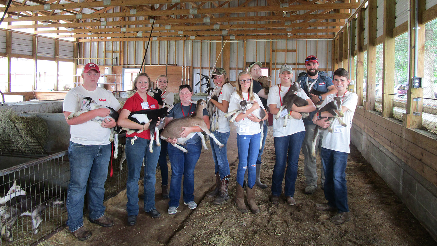 Participants of Livestock Science Camp holding animals.