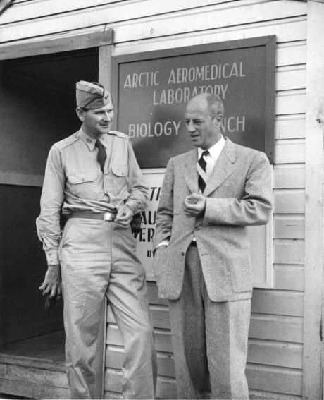 Professor Reinard Harkema with other in front of the Arctic Aeromedical Laboratory