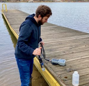 Joseph collecting water quality data in Lake Gaston.