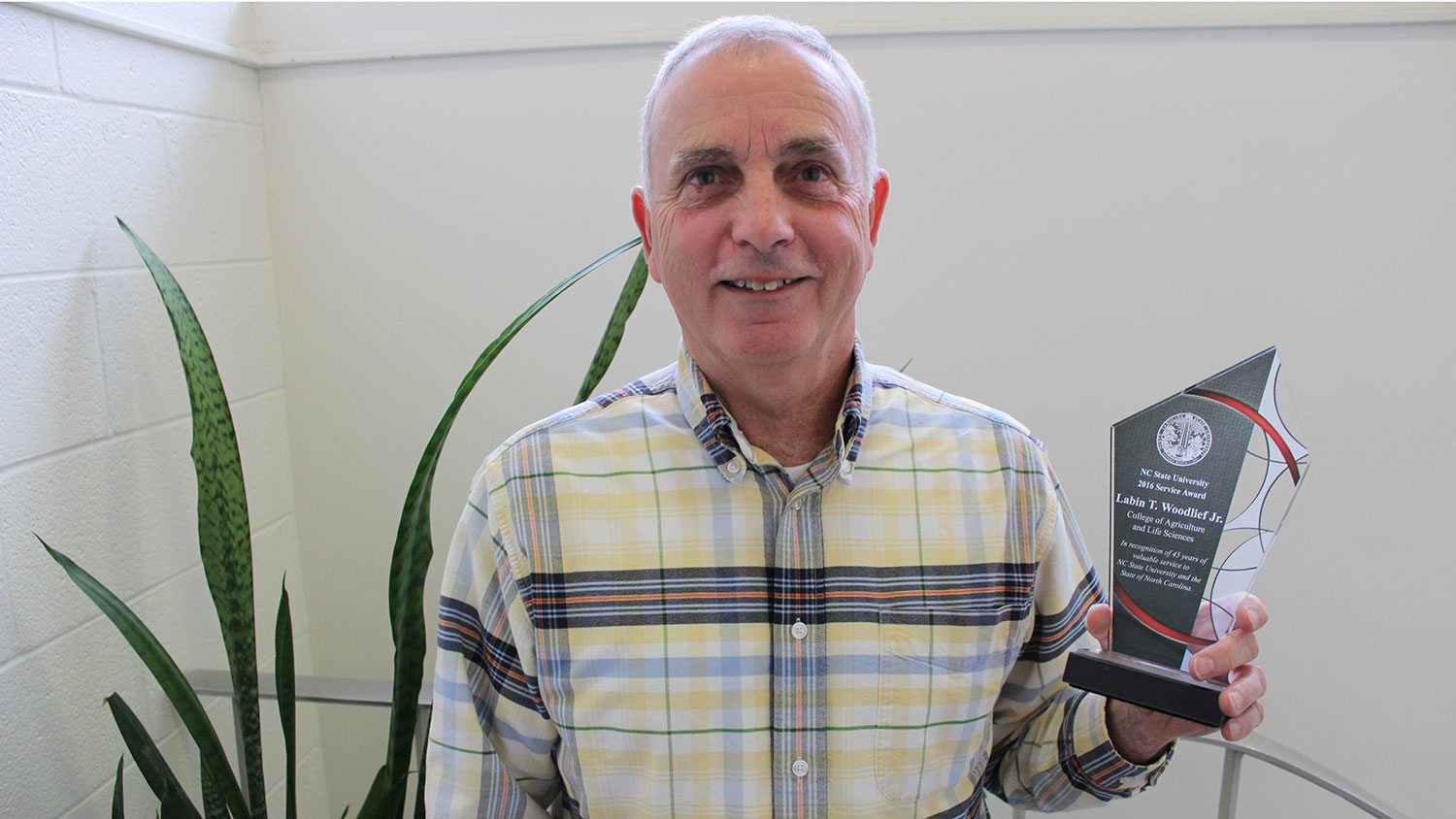 BAE&#039;s L.T. Woodlief receives an award for 45 years of service to NC State