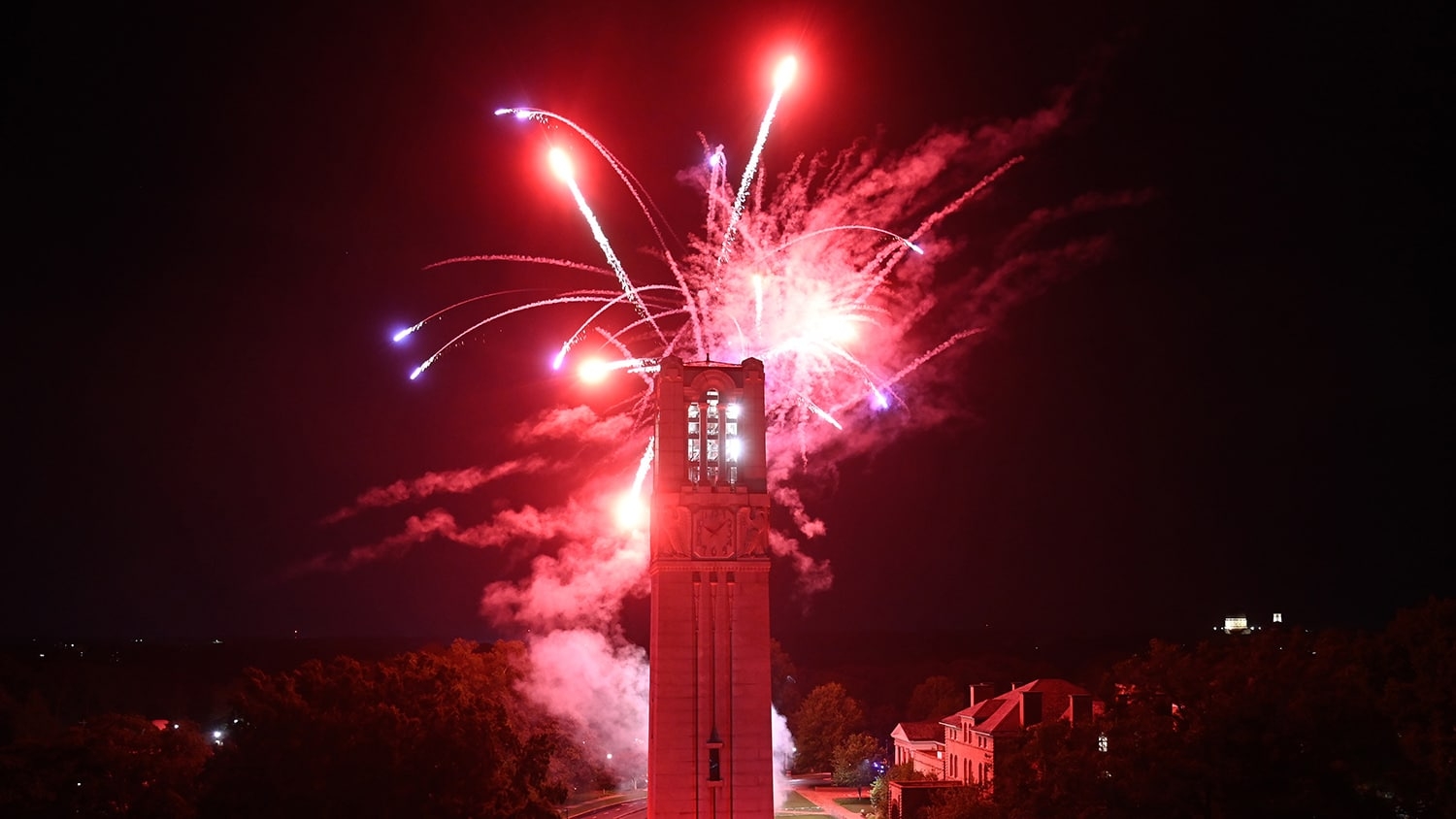 Fireworks explode over the NC State belltower to close down Packapalooza 2022.