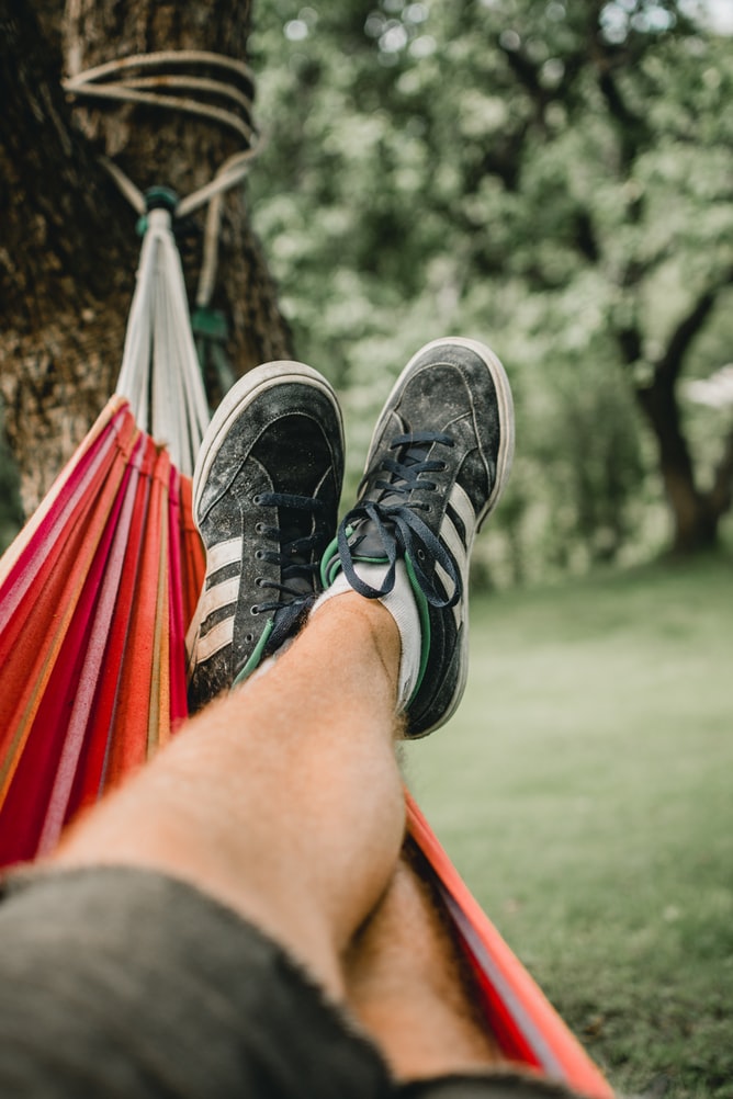 close up of man's legs in a hammock