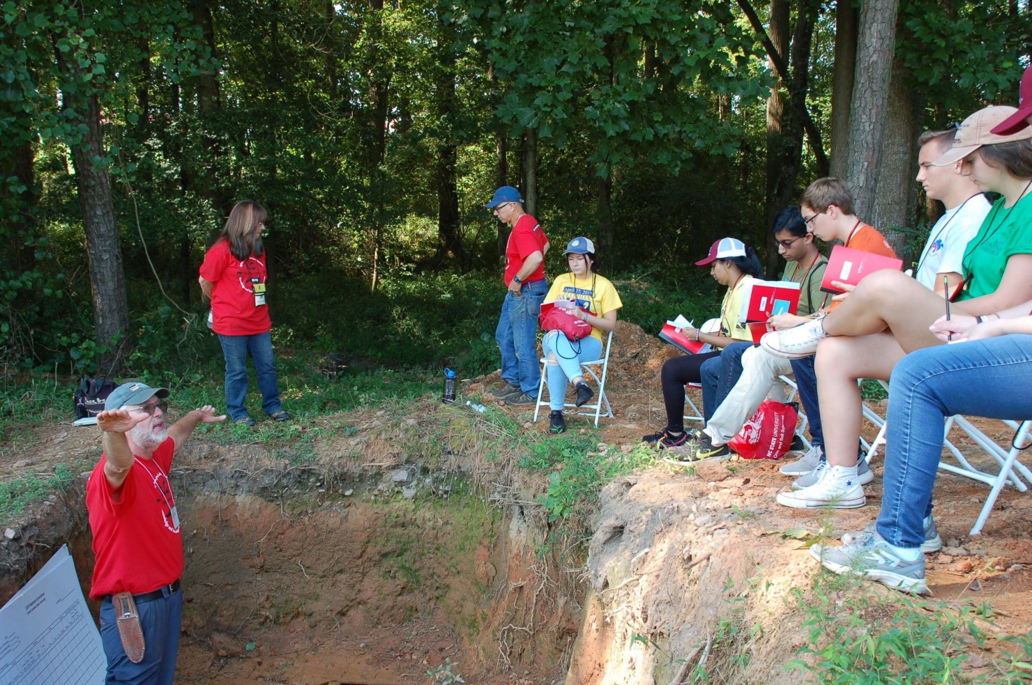 Instructor teaches from a soil pit