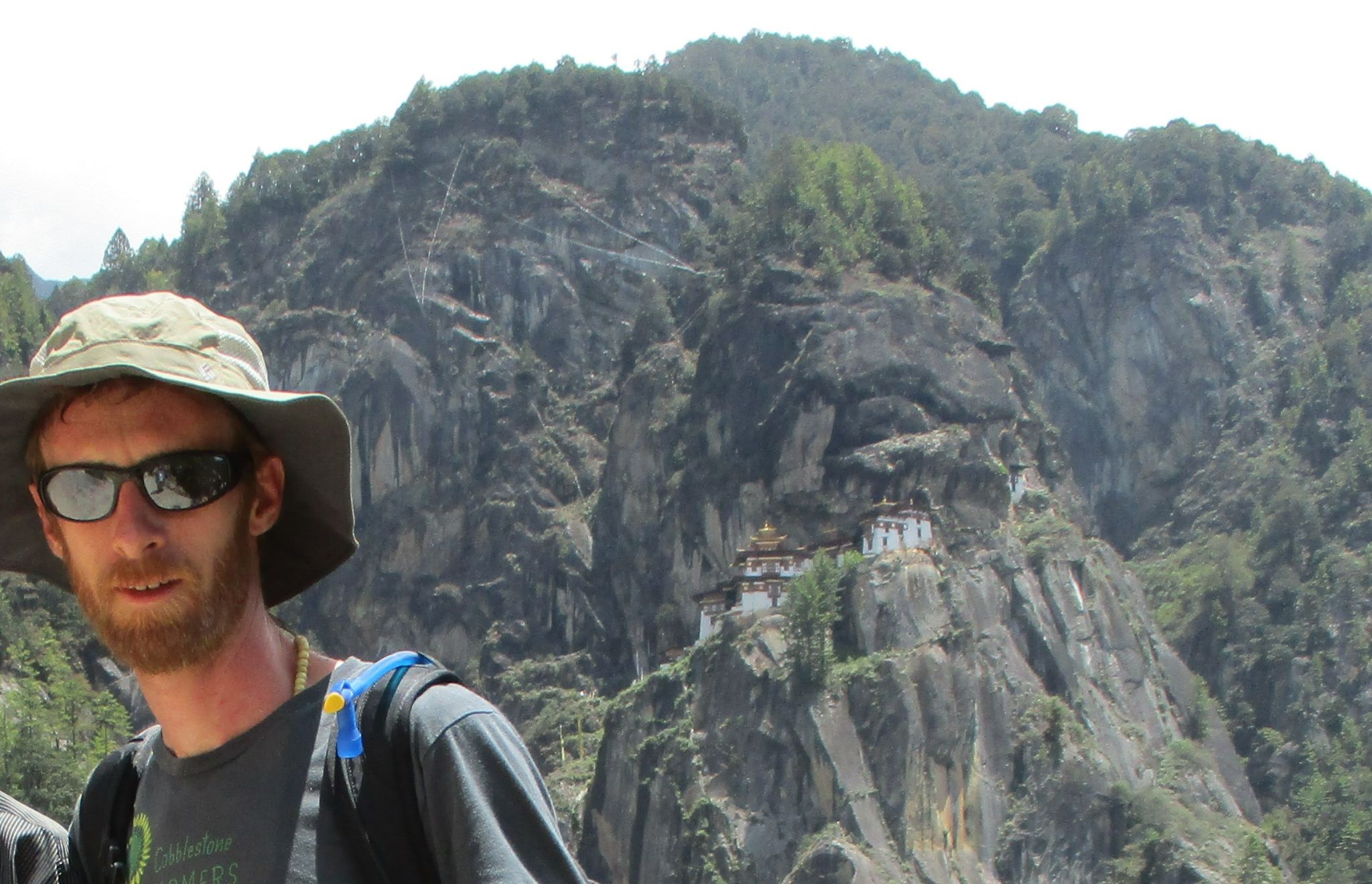 Man in front of a Bhutan mountain