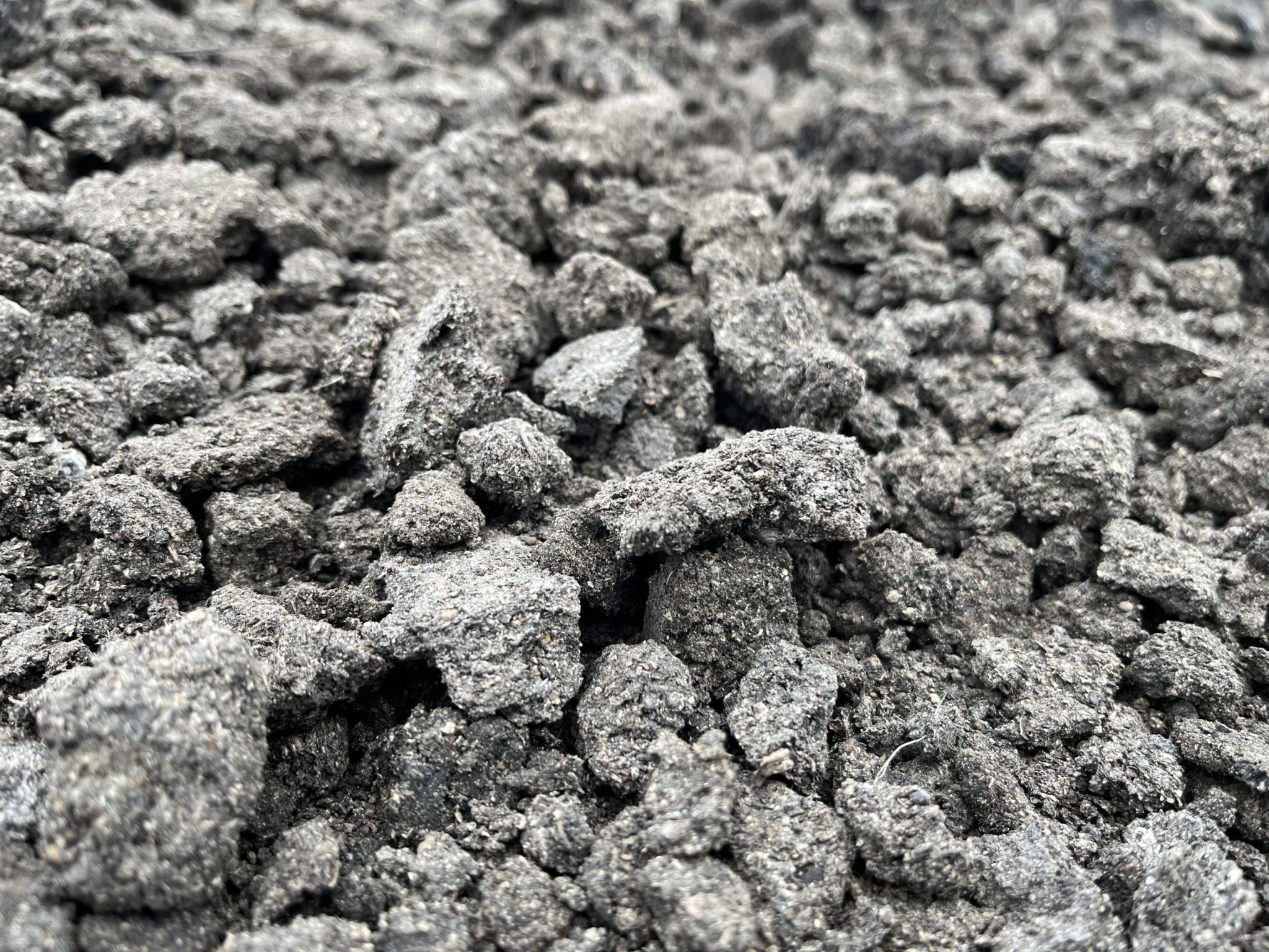 Close up of dried sludge product