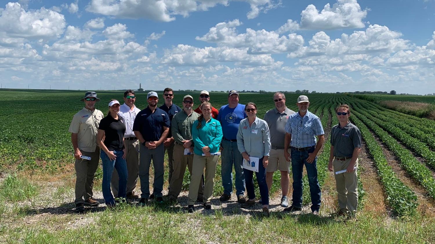 Rachel Vann poses with a NC Extension group on a field visit
