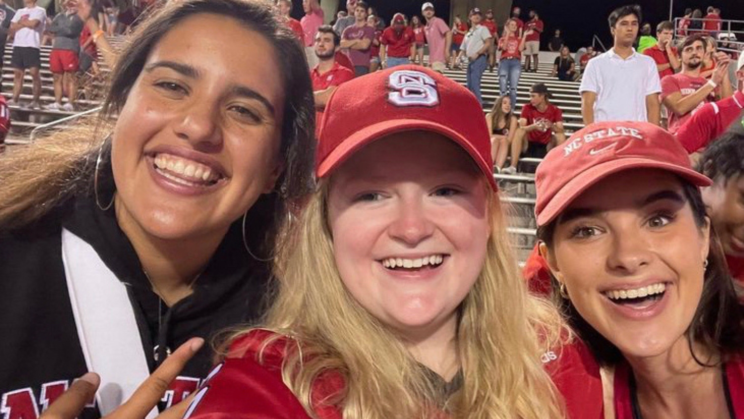 Evelyn McAdam with friends at an NC State football game.