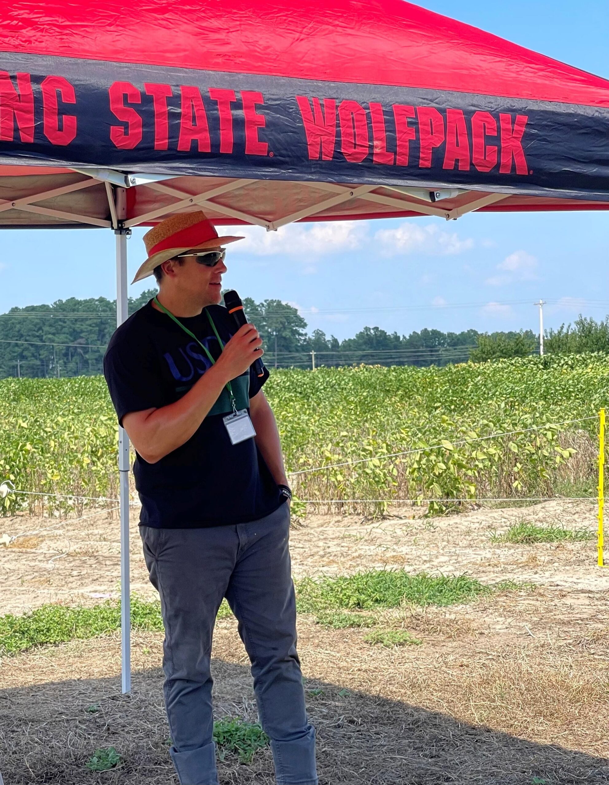 USDA-ARS soybean breeder Ben Fallen speaks at an NC State Extension field day event.
