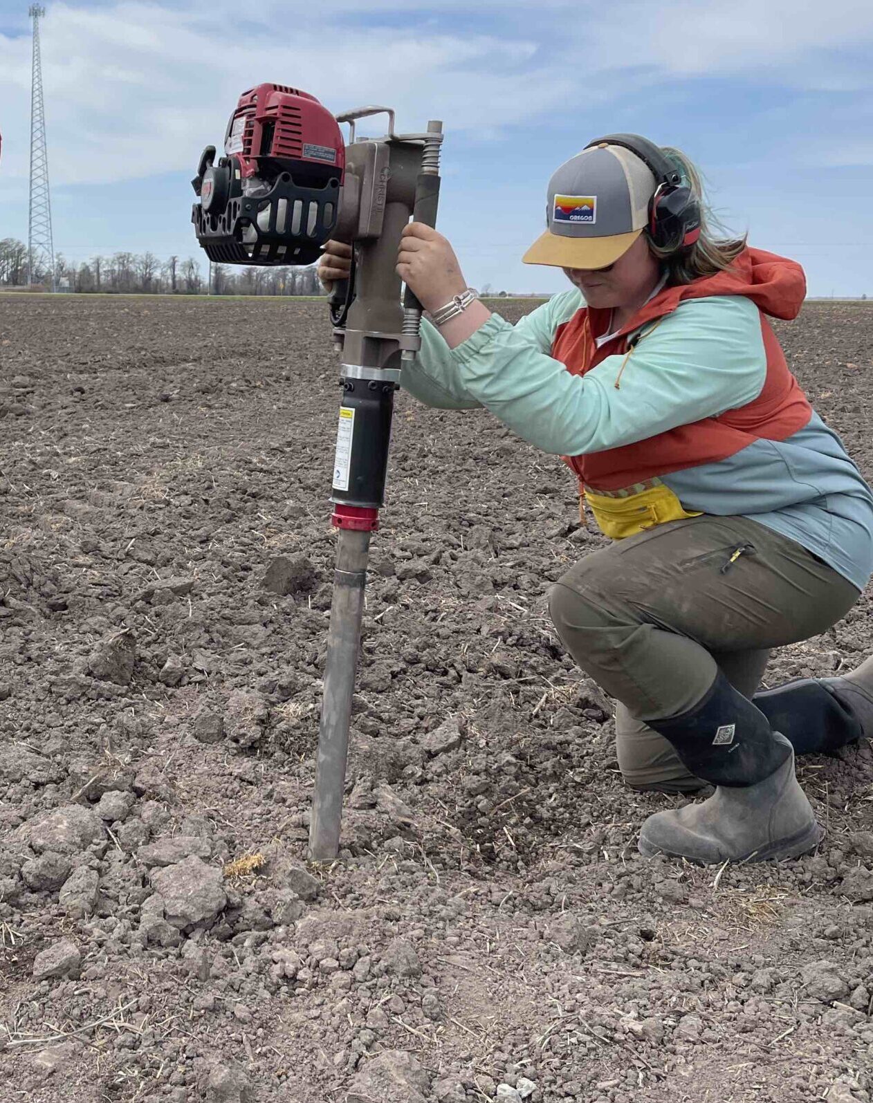 NC State soil science graduate student Julia Janson takes a soil core