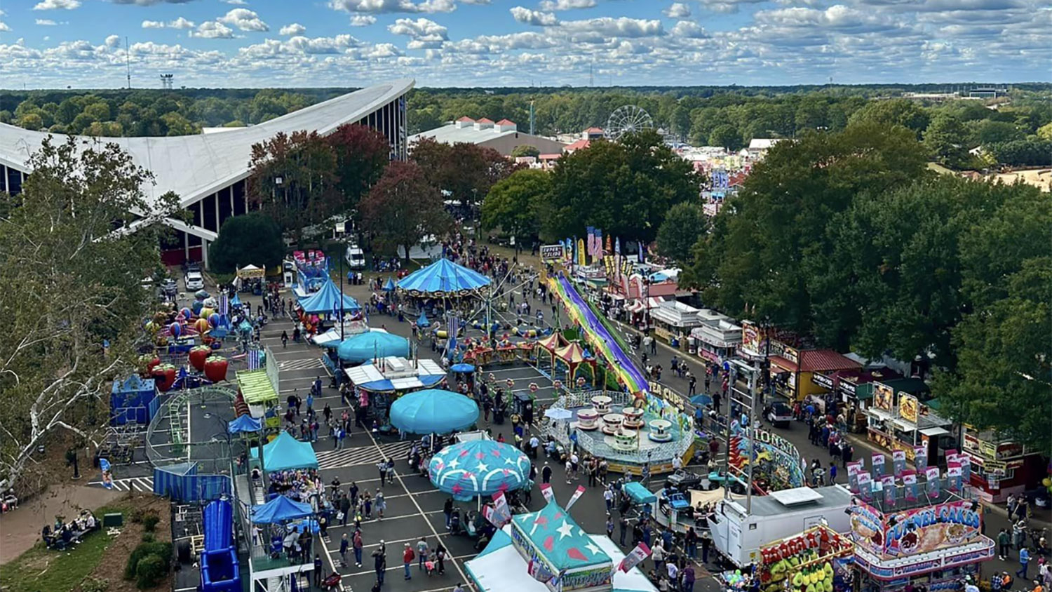 aerial image of fair grounds with rides and food carts