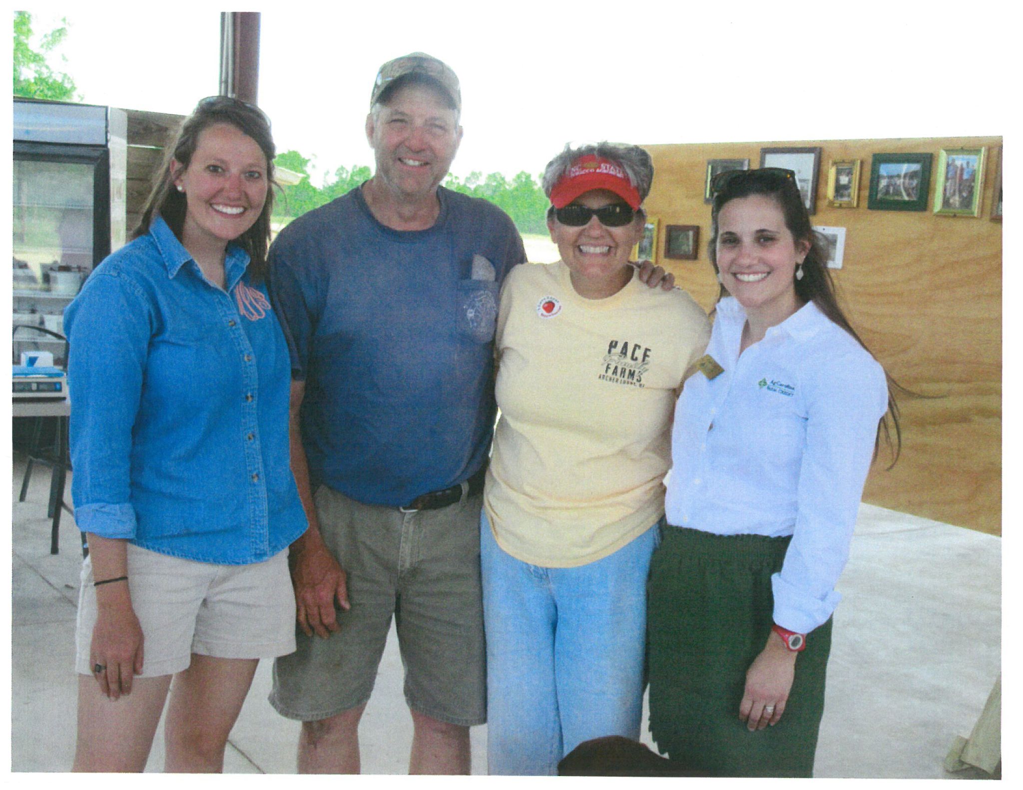 Four adults standing together