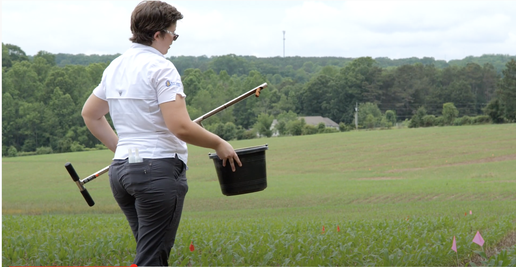 Woman with soil auger