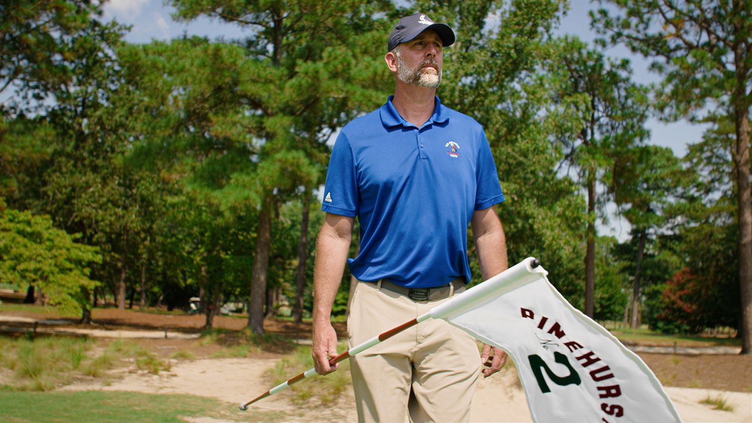 Golf Course Superintendent holding Pinehurst No. 2 flag