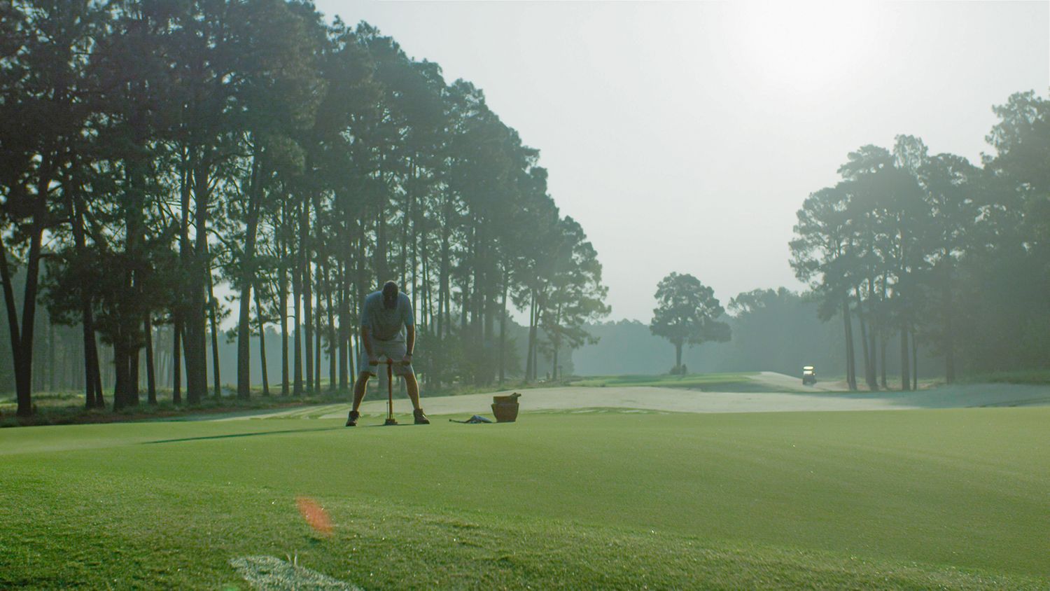 Cutting a golf course cup at Pinehurst No. 2