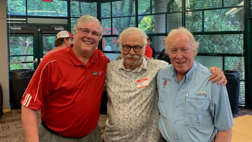 Jeff Mullahey stands with retired Crop and Soil Sciences department faculty