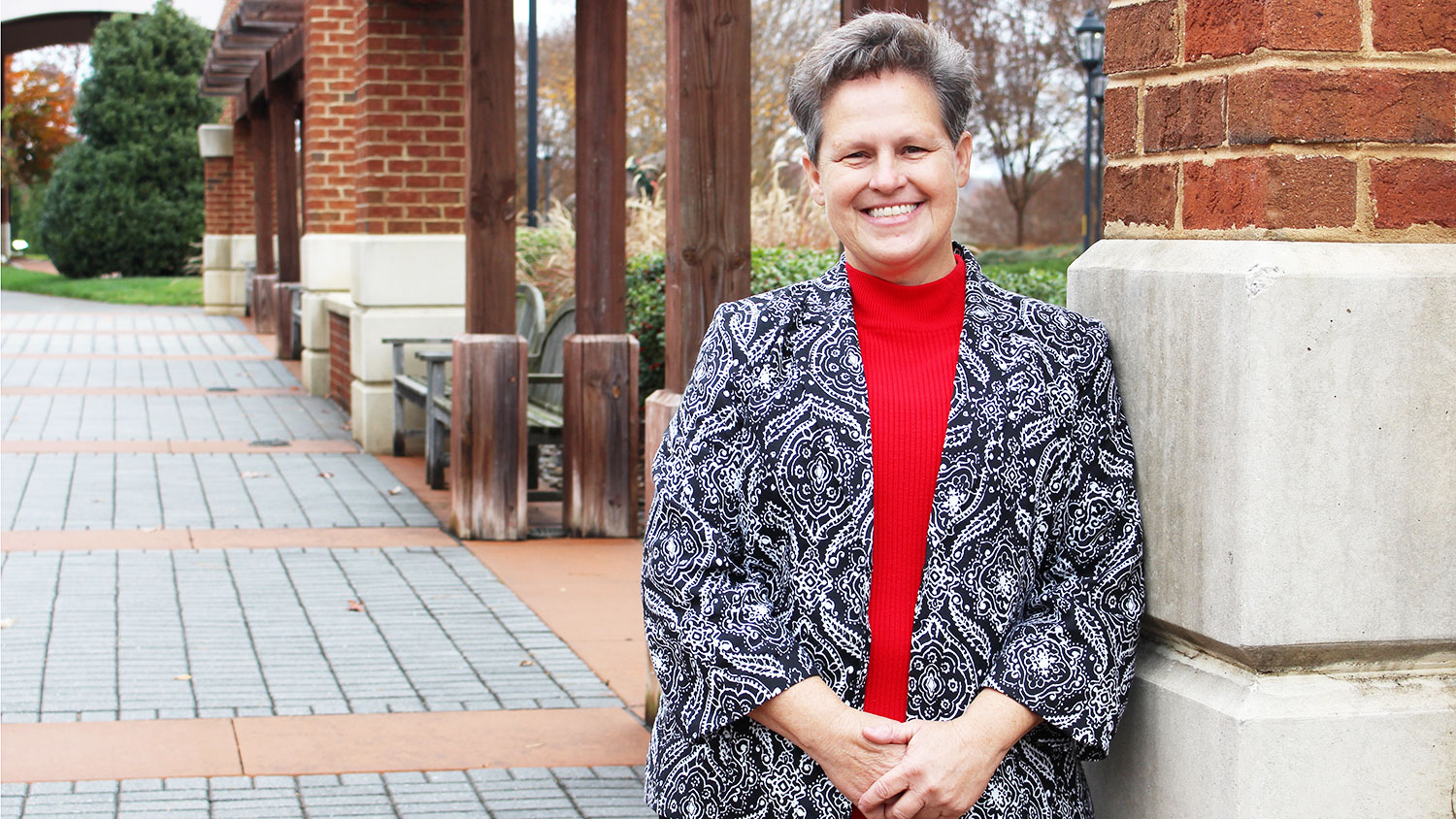 Paula Woodall in front of the State Club at NC State University