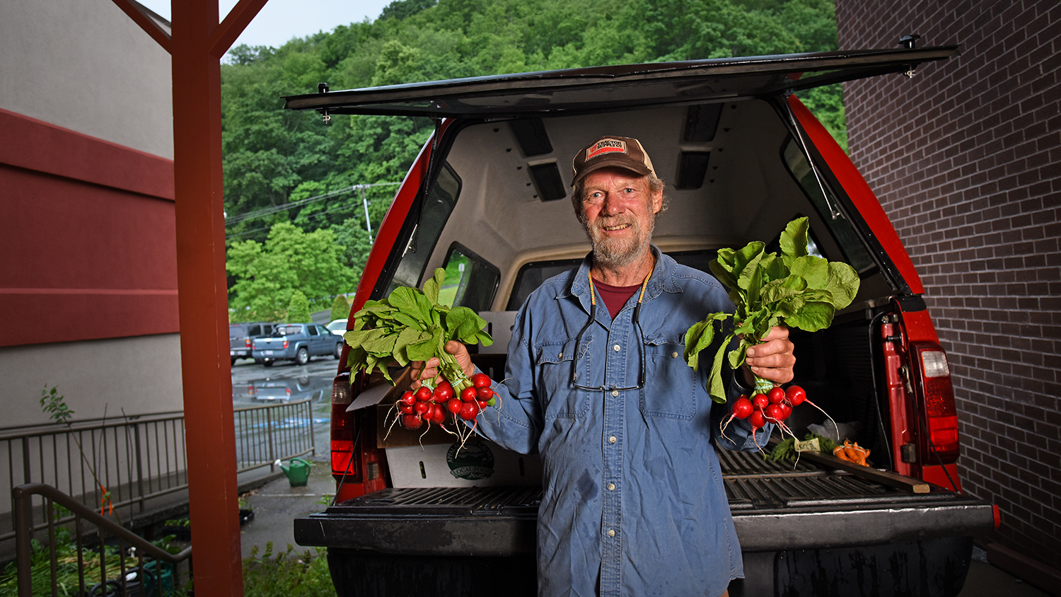 farmer holding radishes