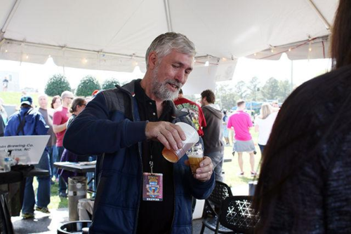 Jon Sheppard pouring a beer
