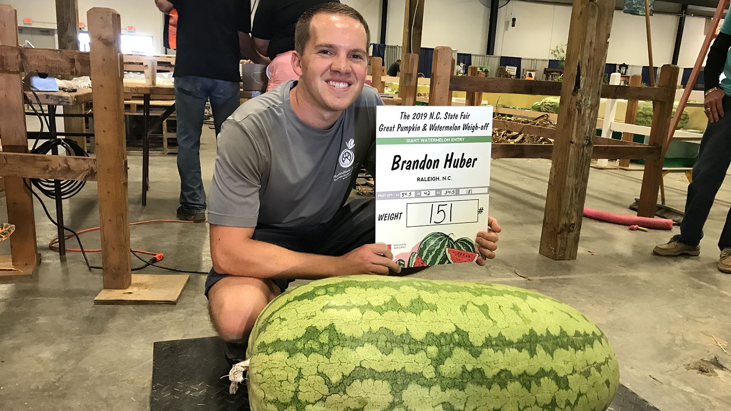 Brandon Huber, showing off his 151-pound watermelon at the NC State Fair.