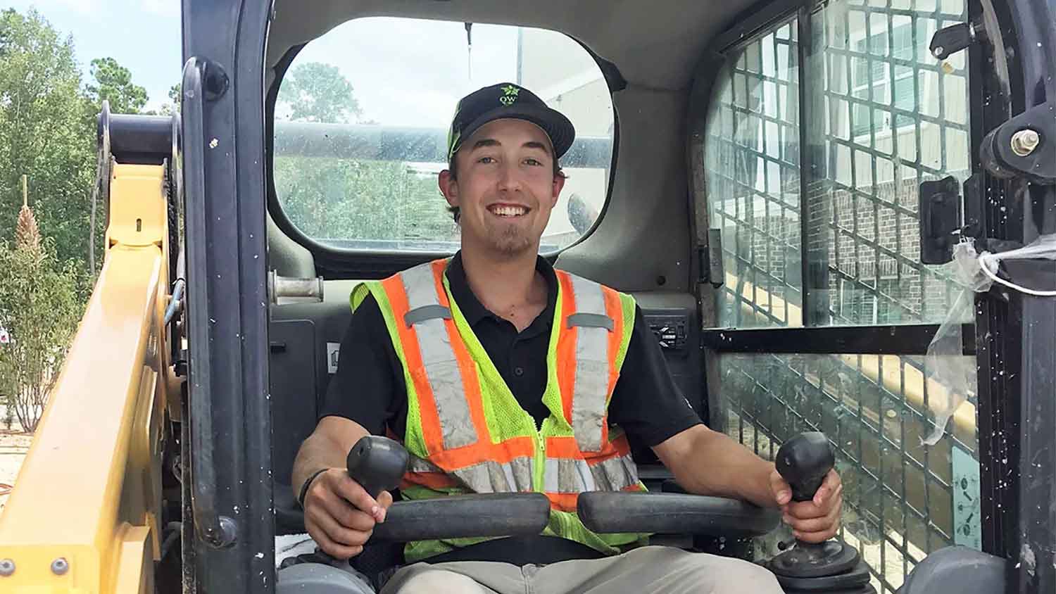 Mason Davis, Ag Institute alum, driving a front-end loader