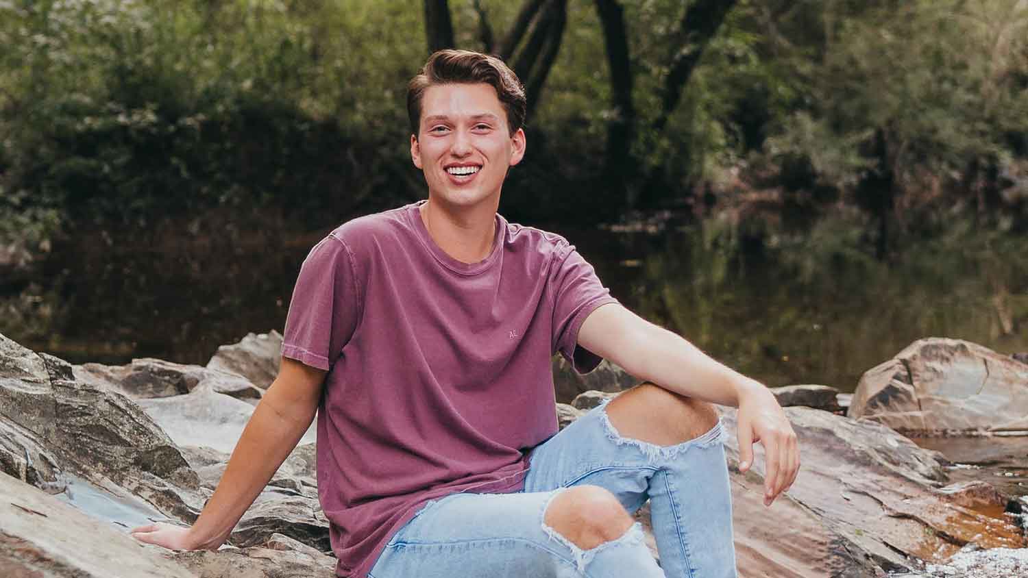 Parker Dearing at a rocky creekside