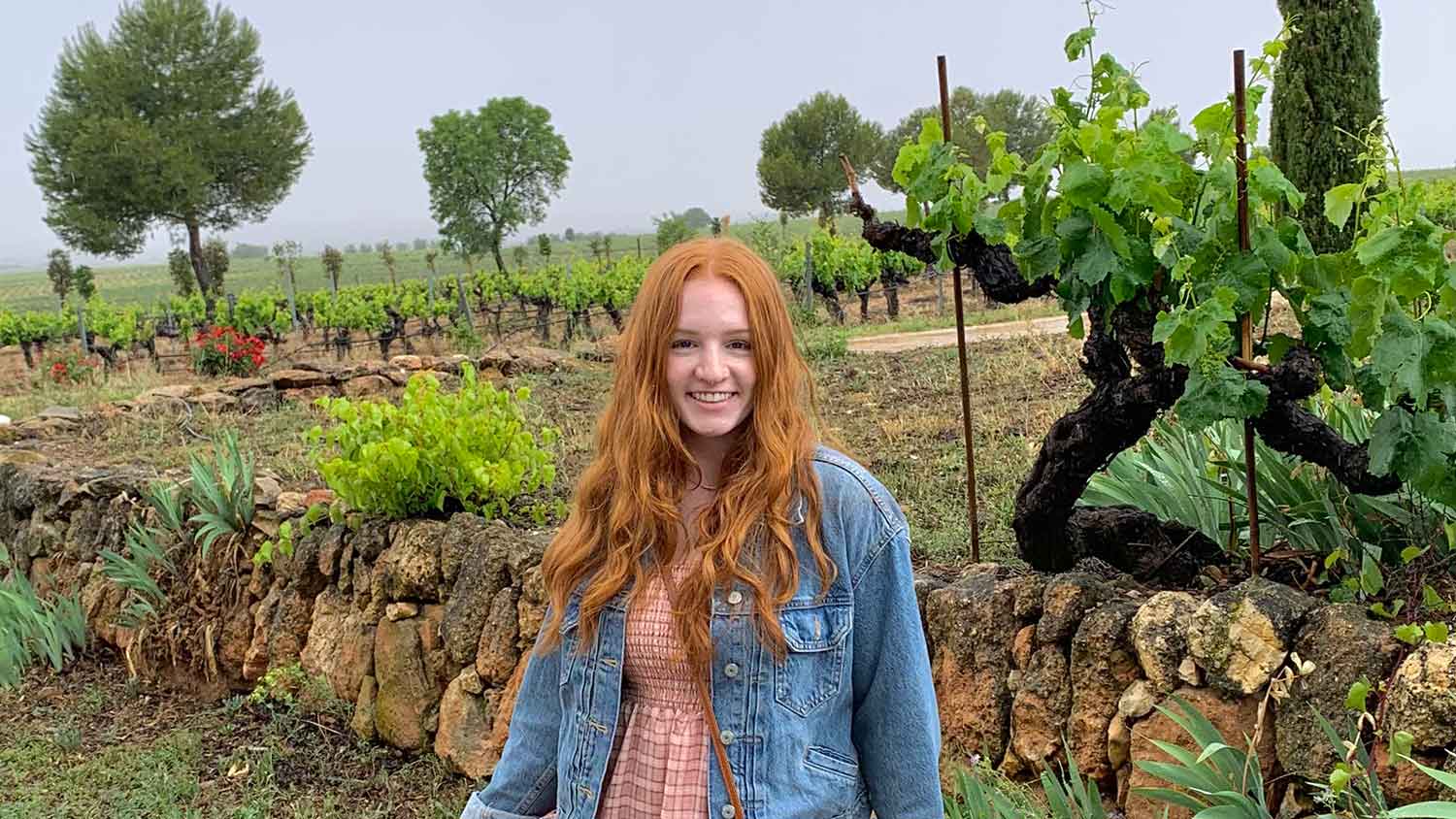 Annie McElvenny in a vineyard