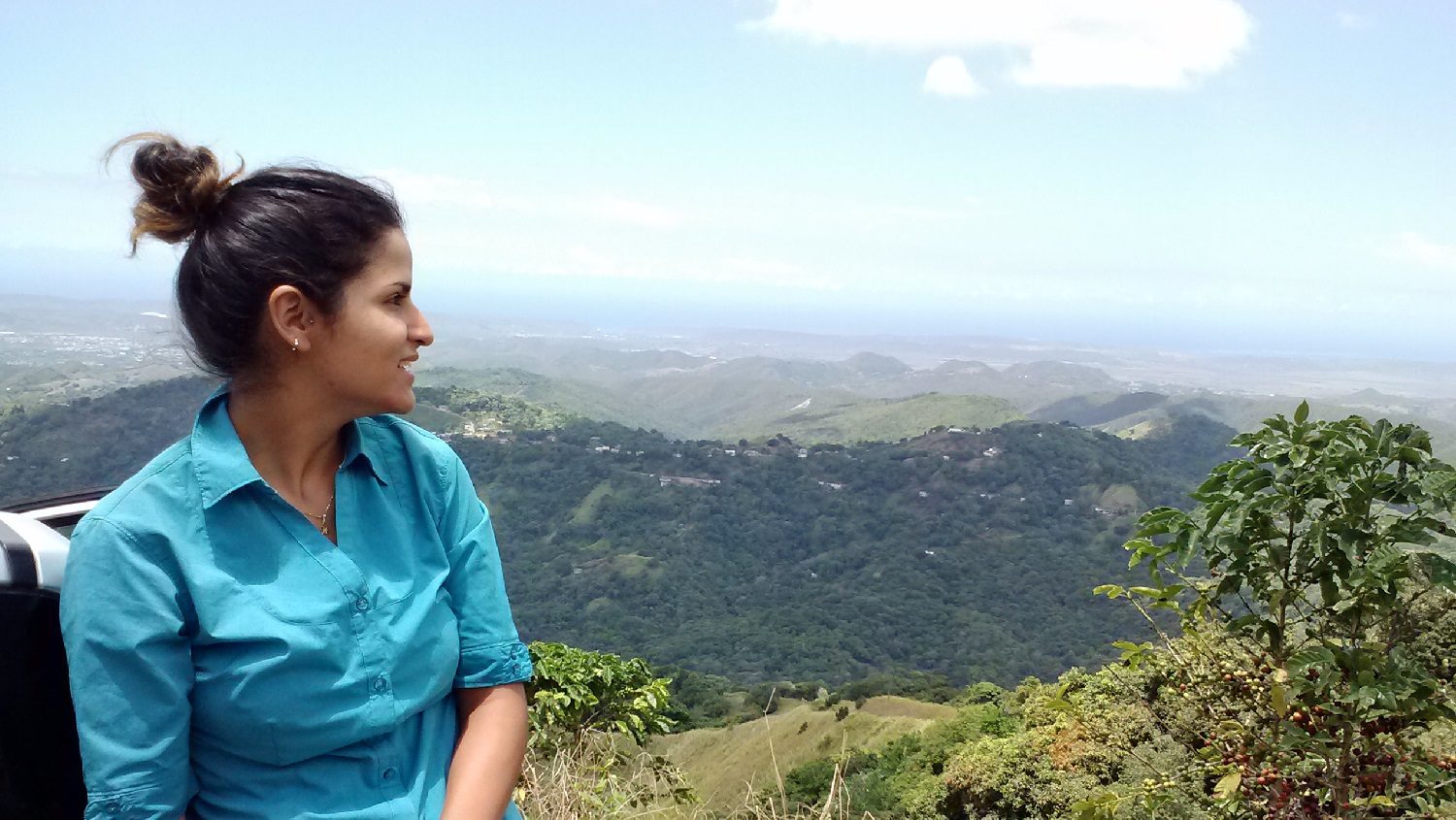 Sara Prado looking over the hillside of coffee plantations, in Maricao, Puerto Rico