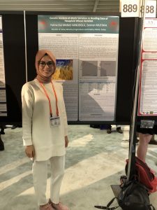 NC State Borlaug Fellow, Fatma Gül Maraş Vanlioğlu, Ministry of Agriculture and Forestry, Field Crops Central research Institute, Biotechnology Research Center - Turkey, posing in front of her research symposium poster