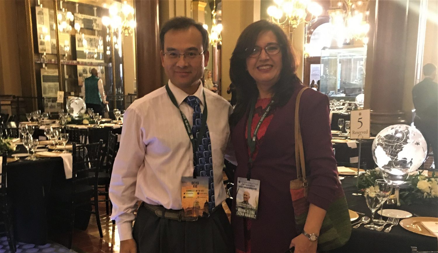 Borlaug Fellow Dr. Maria Elena Cazar and Dr. Deyu Xie from the department of Plant and Microbial Biology, NC State, smile together at the World Food Prize in Iowa