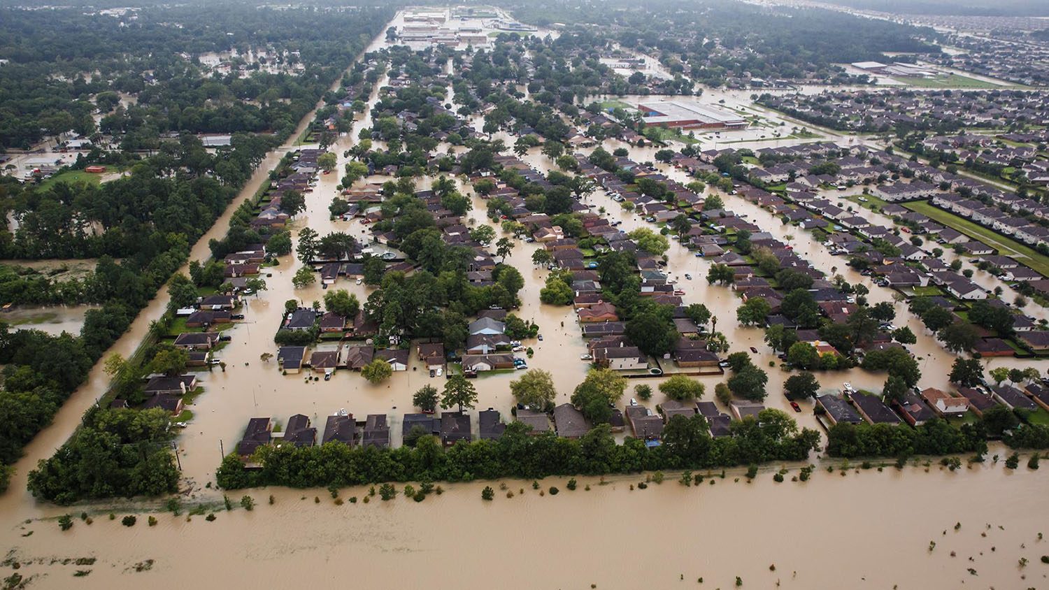 Aerial view of flooded residential area with