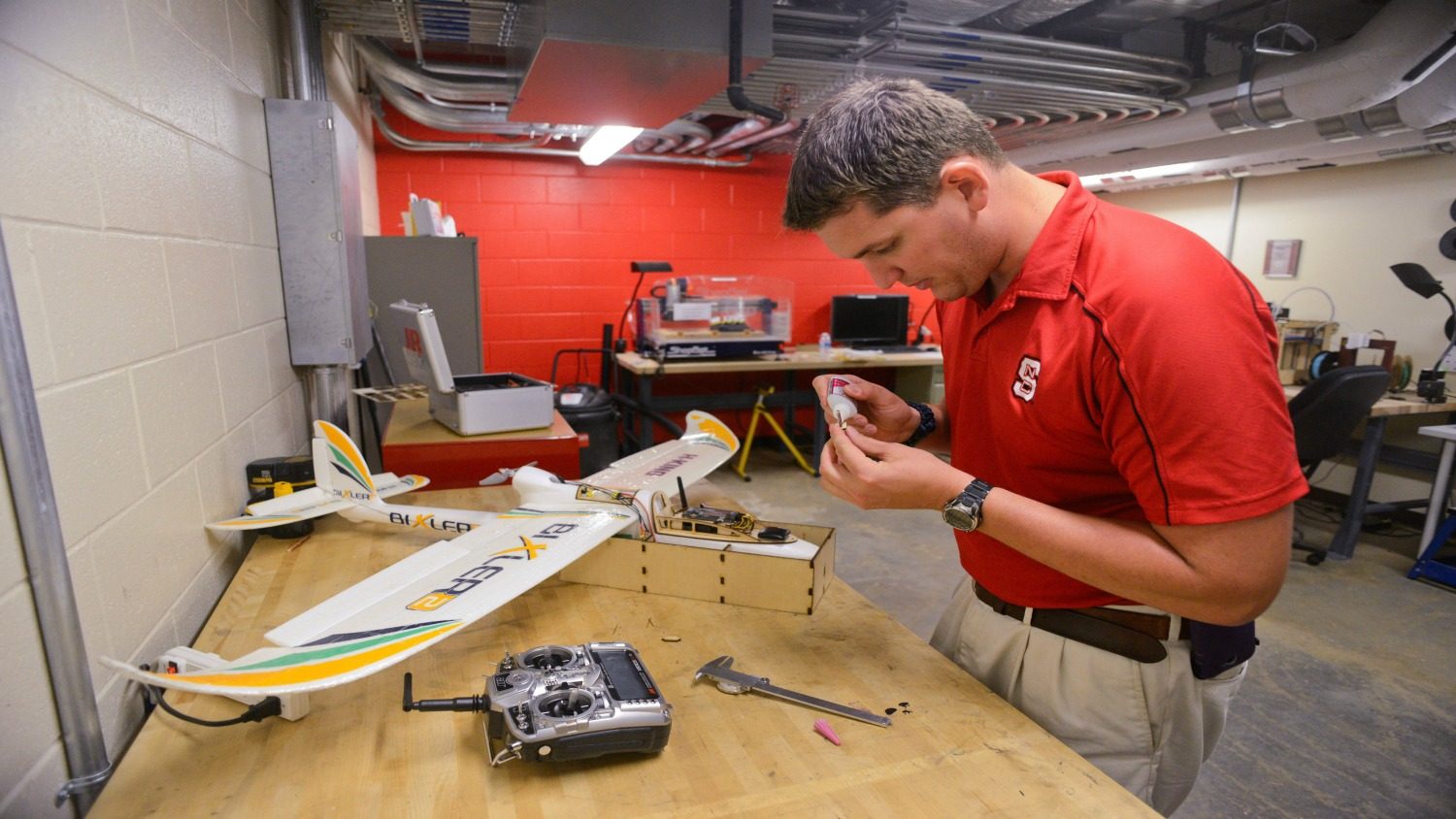 Graduate student Brett Pearce works in the innovation hall garage. He works in RC planes and aeronautics. Photo by Marc Hall