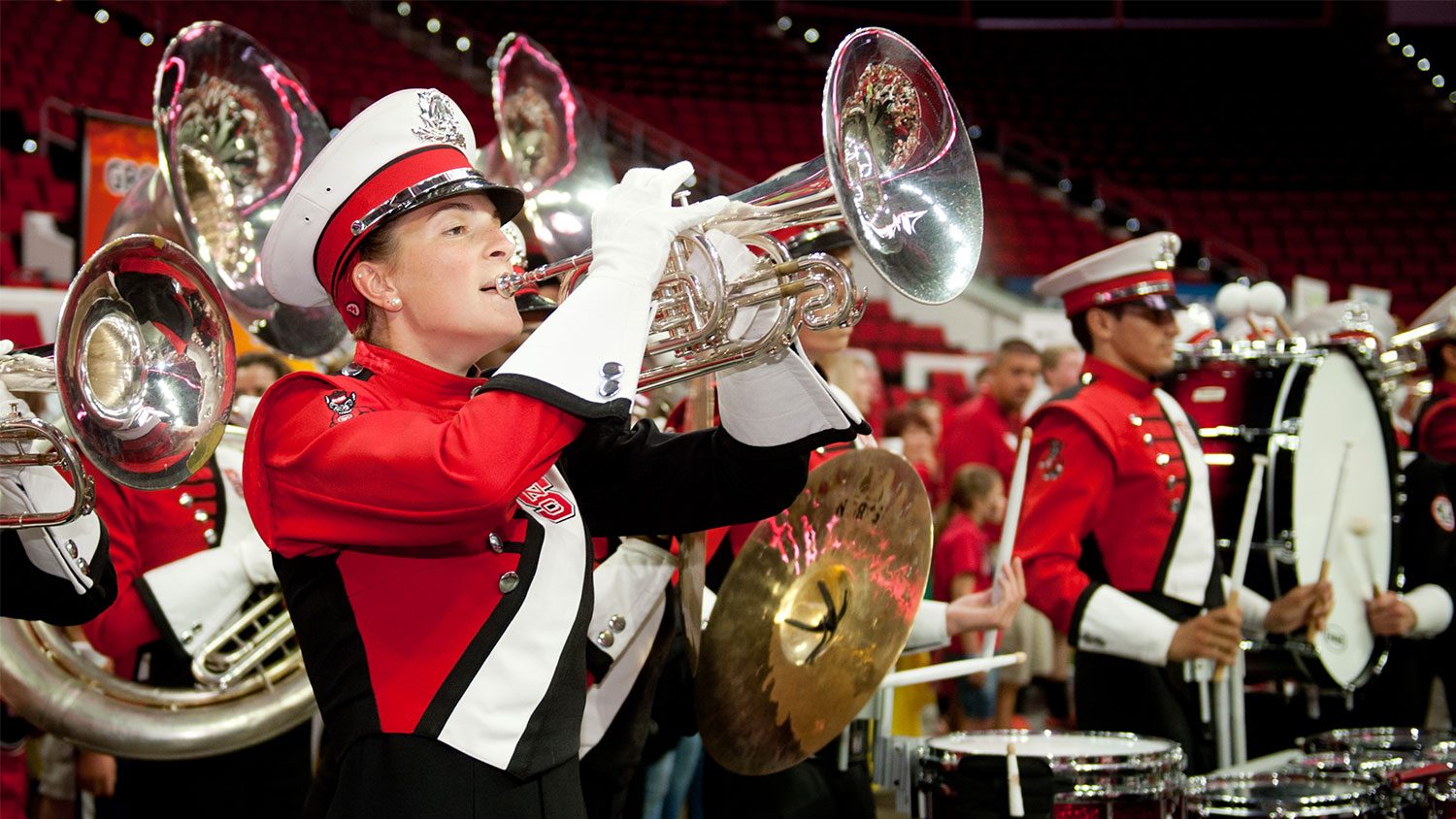 Female Marching Band member playing the tuba.