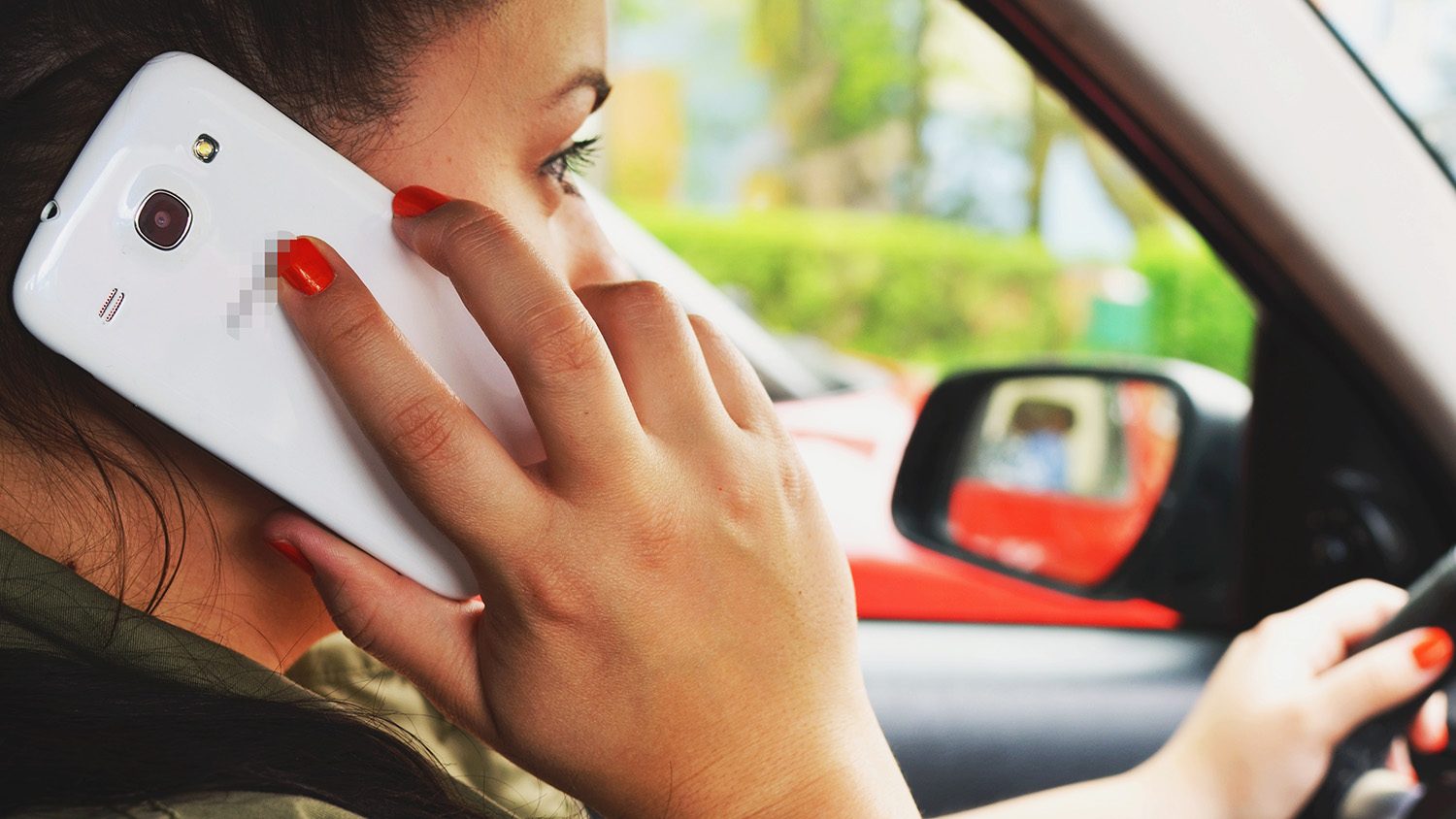 a driver on the phone while driving.