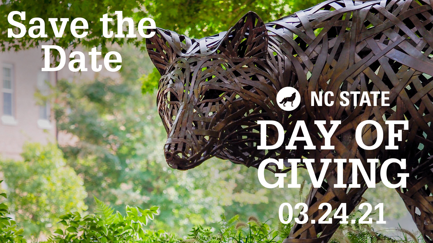 Save the Date for NC State Day of Giving 3.24.2021 text over of closeup of wolf sculpture in Stafford Commons